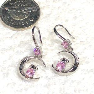 🐄pink and silver cow earrings on a crescent moon